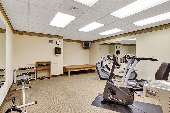 Small indoor gym with bikes and weights