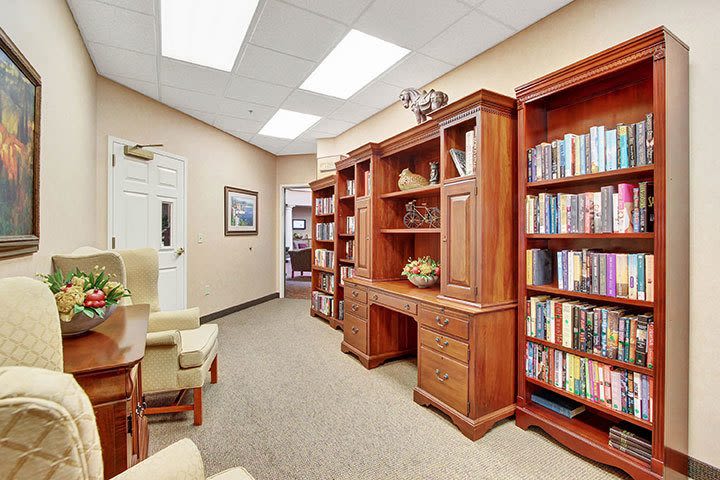 Office study with wooden bookshelves and desk